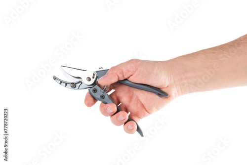 Steel garden secateurs, scissors with gray plastic handle in male's hand isolated on a white background.