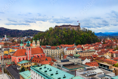 View of the old town and the medieval Ljubljana castle on top of a forest hill in Ljubljana, Slovenia