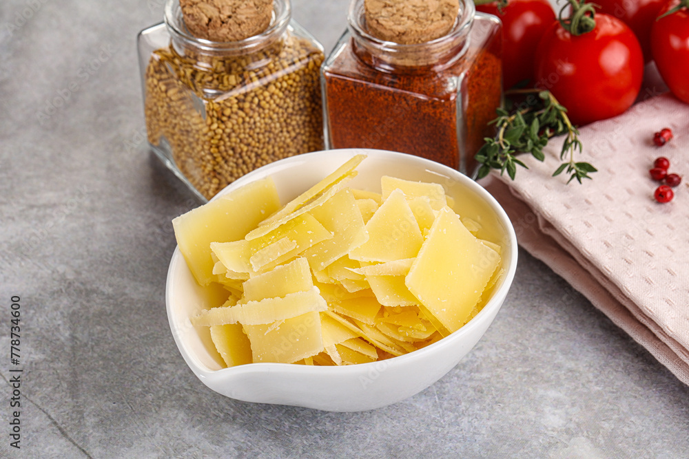 Sliced parmesan cheese in the bowl