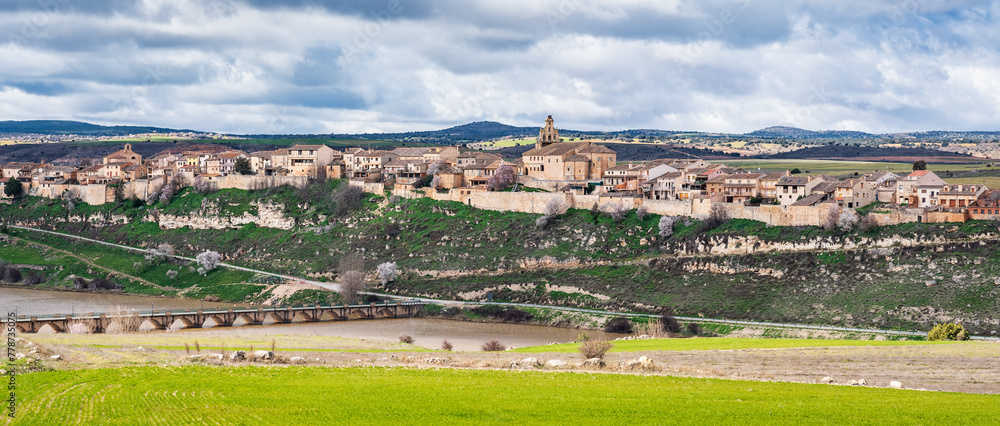 Great panoramic view of the picturesque village of Maderuelo located in a ravine, Segovia, Spain.