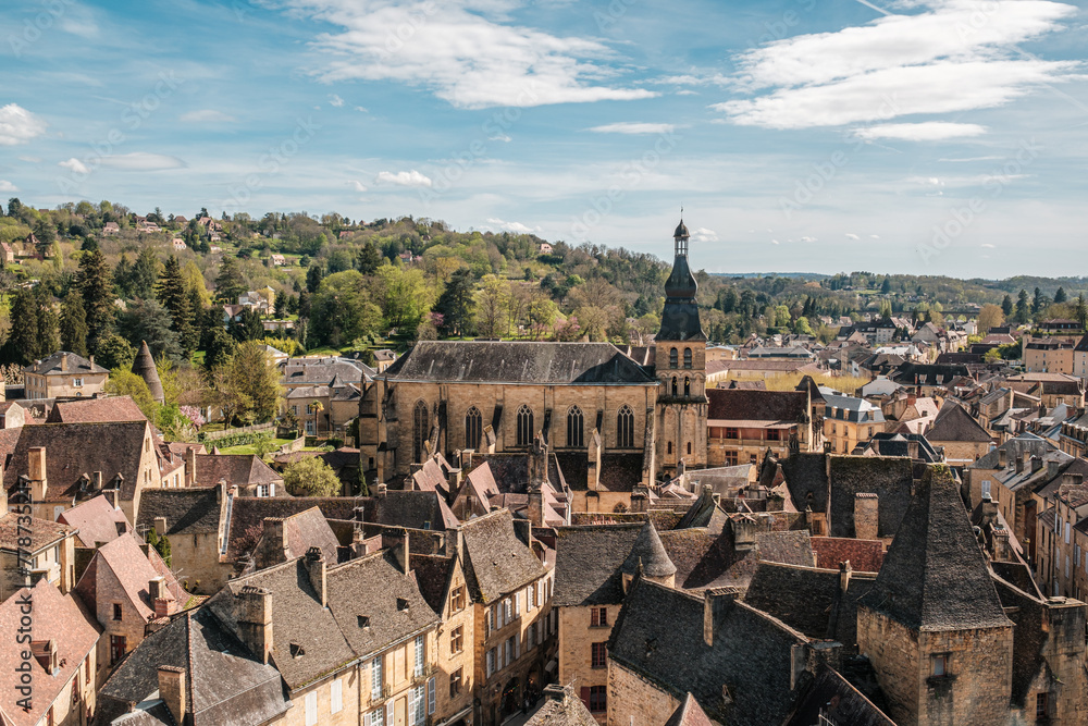 View over the rooftops of Sarlat-la-Caneda in the Dordogne region of France looking towards the Cathedrale Saint Sacerdos