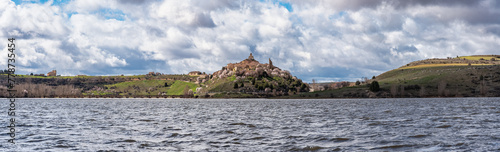 Great panoramic view of the medieval village of Maderuelo located next to a large lake, Segovia, Spain. photo