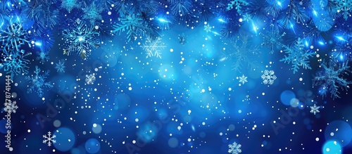 Electric blue snowflakes are fluidly falling against a moist background, creating a mesmerizing science event in a space filled with precipitation drops photo