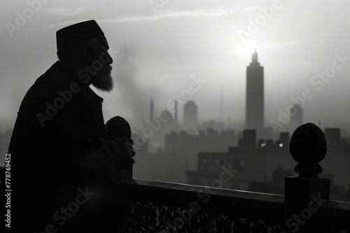 A mysterious figure stands silhouetted against a sunset, overlooking a cityscape where buildings are faintly visible
