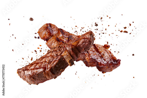 Pork steak with spices isolated on a white or transparent background. Grilled pork chops, beef steaks, grilled pieces of meat flying in the air. Barbecue meat graphic element.
