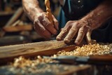 Close-up of a carpenter's hands as he meticulously shaves wood with a hand planer, focused on his craft