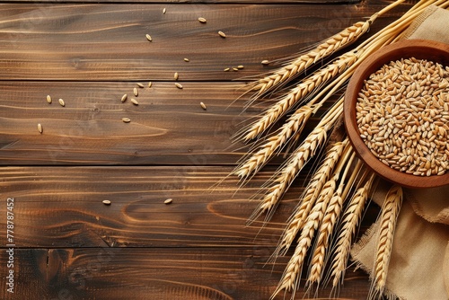 Bunch of golden wheat ears next to a bowl of grains on a rustic wooden table, embodying natural whole grain goodness.
