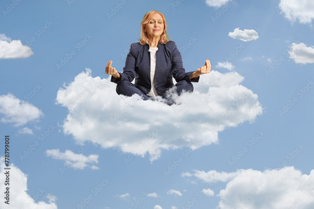 Woman sitting and practicing meditation on a cloud Woman sitting and practicing meditation on a cloud