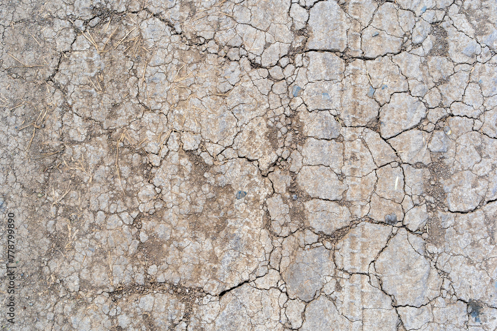 dry soil arid or ground and land crack broken to drought on area lacks water by top view from El Niño or La Niña for agriculture and floor texture background - obrazy, fototapety, plakaty 