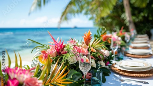 Wallpaper Mural Beachside table with vibrant floral centerpiece, perfect for event planning and tropical decor. Torontodigital.ca