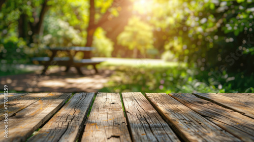 Empty Wooden Table with Garden Background photo