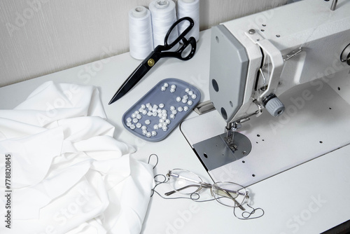 Sewing accessories on the table, sewing a wedding dress