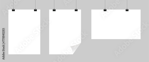 Realistic hanging blank paper sheet with shadow in A4 format and black paper clip, binder on gray background. Design poster, template or mockup. Vector illustration.