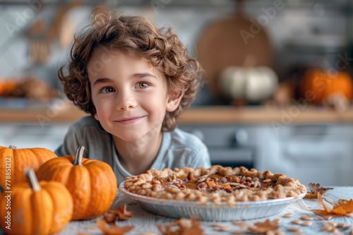 A cute boy with a large pumpkin pie on the background of a light rustic kitchen. A Thanksgiving card. Traditional seasonal autumn pumpkin desserts. A horizontal illustration with space for text.