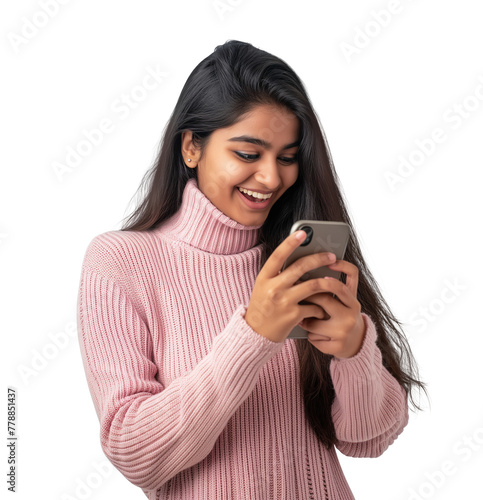 Joyful South Asian girl smiling looking at her phone in her hand