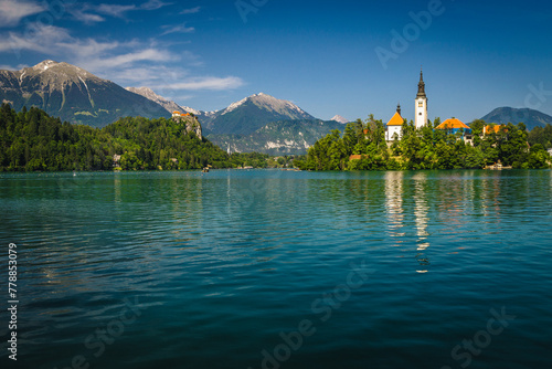 Amazing view with famous chuch on the green island, Slovenia photo