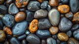 Vivid close-up image showcasing a variety of colorful, smooth pebbles with intricate details