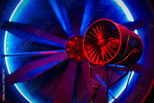 Axial photostudio fan in the neon lights background. Photo studio equipment. photo