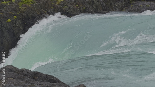 Slow Motion Close-up of Turquoise Glacial Waterfall in Rain