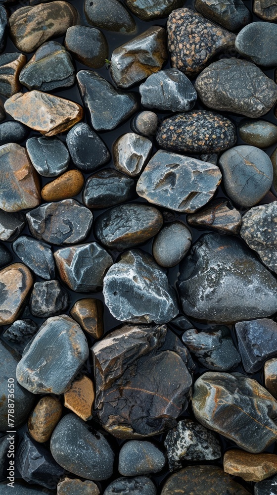 High detail image showcasing a variety of smooth river rocks creating a natural textured background High detail image showcasing a variety of smooth river rocks creating a natural textured background