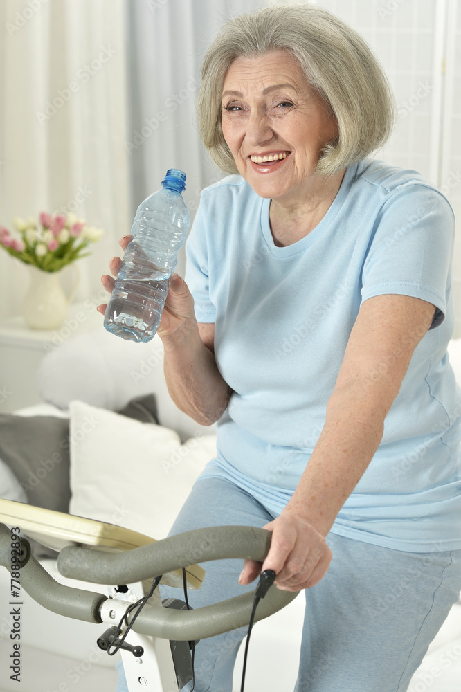 Elderly woman exercising on an exercise bike