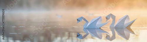 Optic white origami swans floating on a conservation pond, tranquil dawn