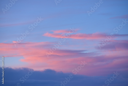 Evening sunset sky. Light blue yellow clouds in the sky. © Lushchikov Valeriy