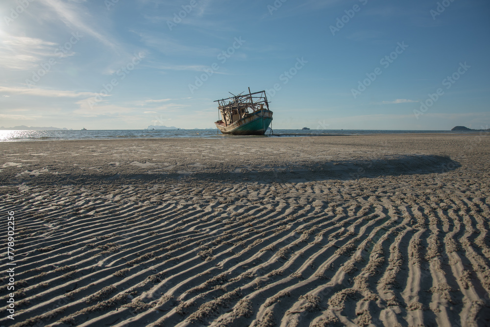 Fototapeta premium Wreck of a fishing boat on the beach