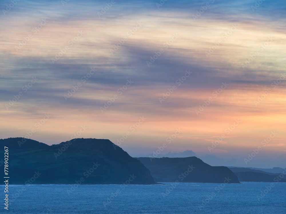 The jurassic coastline with Lyme Bay captured on January mornings from Lyme Regis in Dorset The jurassic coastline with Lyme Bay captured on January mornings from Lyme Regis in Dorset