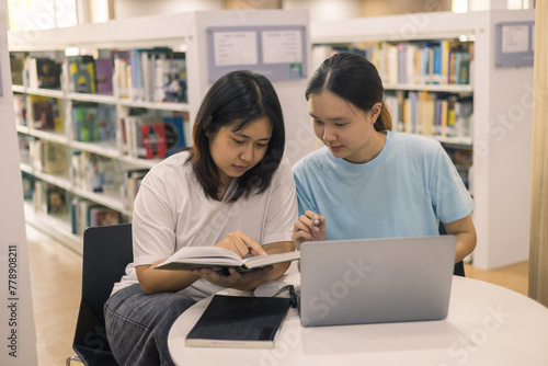 Two young woman, a dedicated student, navigates university life with her friend, embracing education and growth as they pursue their goals together. female student in college © doidam10