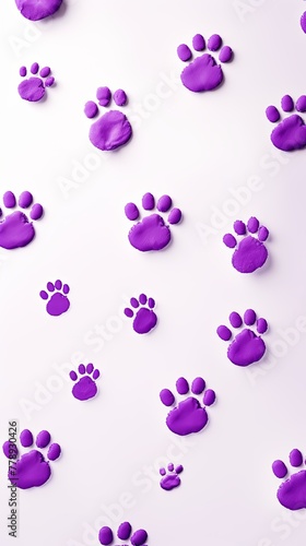 Purple paw prints on a background  minimalist backdrop pattern with copy space for design or photo  animal pet cute surface 
