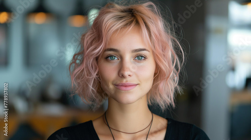 Portrait pink haired young woman, 20 - 25 years old. Female barista or waiter, administrator or hostess of a restaurant small business looking at camera and standing at workplace. 