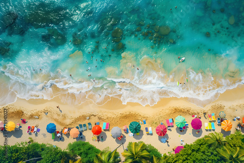 A far away aerial view of a beautiful beach filled with colorful umbrellas and sunbeds