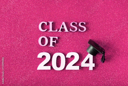 Class of 2024 text with graduated cap. Graduation holiday concept.