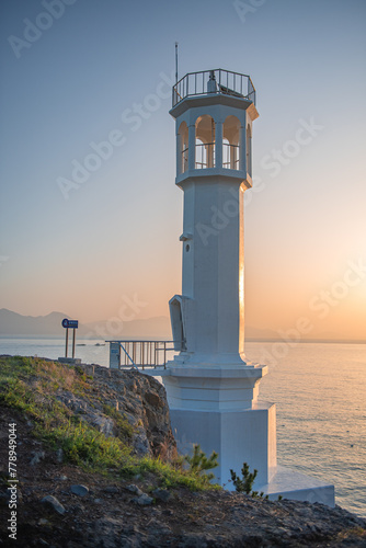 Morning view of the beach with a lighthouse view 