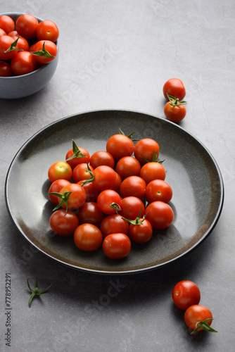 closeup cherry tomatoes on grey plate