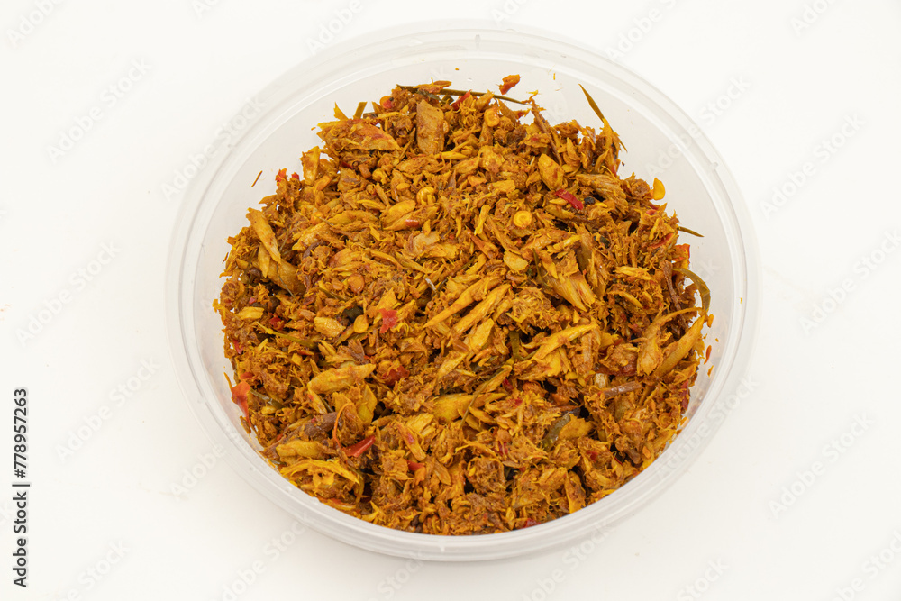 Thai food - Top view , side view of Thai Southern Style Curry with longtail tuna in plastic cup on white background. Closeup Fish-kidney paste. Thai food - Top view , side view of Thai Southern Style Curry with longtail tuna in plastic cup on white background. Closeup Fish-kidney paste.