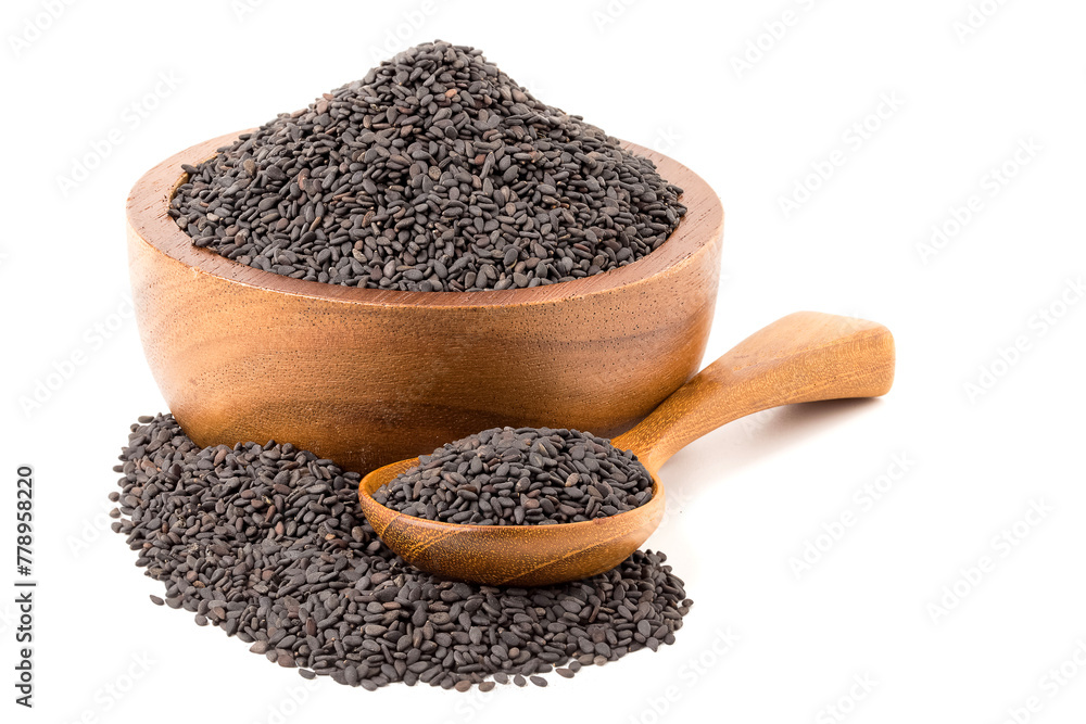Poppy seeds in a wooden cup and poppy seeds in a wooden spoon. isolated on white background. Poppy seeds in a wooden cup and poppy seeds in a wooden spoon. isolated on white background.