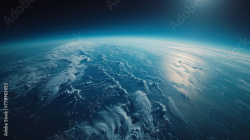 Stunning high-altitude view of Earth's atmosphere and curvature with sun reflecting off the ocean, showcasing the planet's beauty and space's vastness.