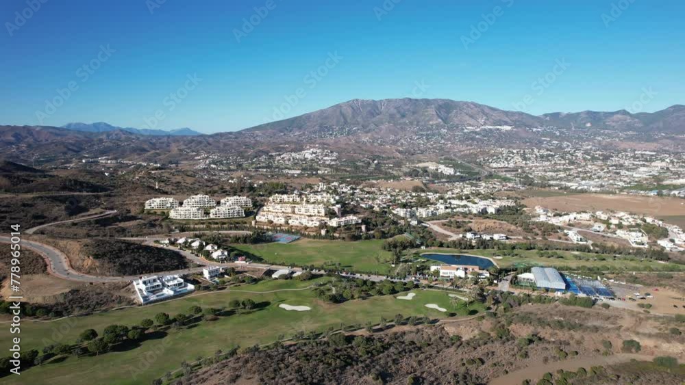 Aerial view of Golf course. Establishing shot, flying over golf club. Early morning, summertime, sunlight. Aerial Spain. Aerial view of Golf course. Establishing shot, flying over golf club. Early morning, summertime, sunlight. Aerial Spain.