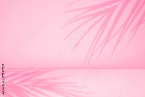 empty pastel pink studio room with palm shadow for products presentation. background of wall and floor for studio room. pink room with curtains