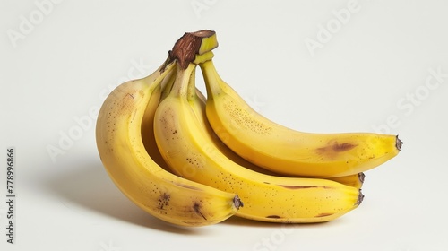A bunch of bananas on a white background. An exotic fruit. Delicious and juicy bright yellow bananas.