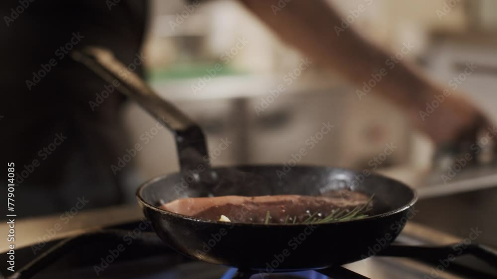 Close up of a chef cooking octopus in a hot pan. Gastronomic french restaurant Close up of a chef cooking octopus in a hot pan. Gastronomic french restaurant