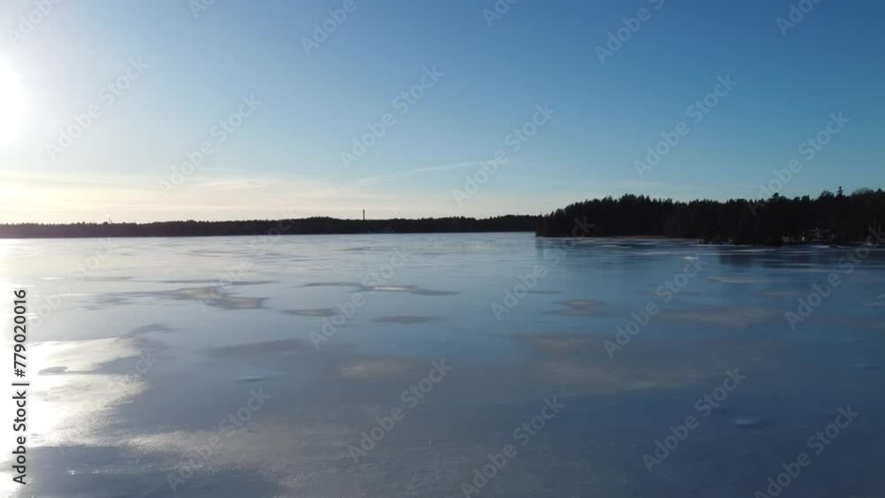 Aerial view of an icy lake on a sunny spring day. Littoinen, Finland Aerial view of an icy lake on a sunny spring day. Littoinen, Finland