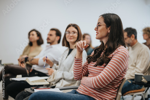 фотографія Group of attentive employees listening to a speaker at a seminar
