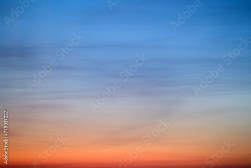 An abstract background of red-blue clouds in the dark evening sky