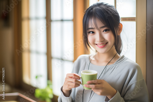 Teen pretty Japanese girl with matcha green tea