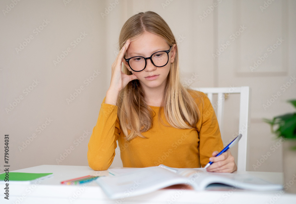 Teen Girl Studying at Home During Daytime, Making Homework