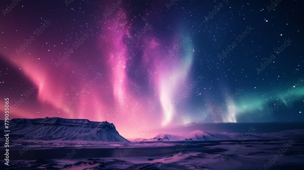 A breathtaking view of the Northern Lights, also known as Aurora Borealis, dancing over a serene snowy landscape under a starry sky.