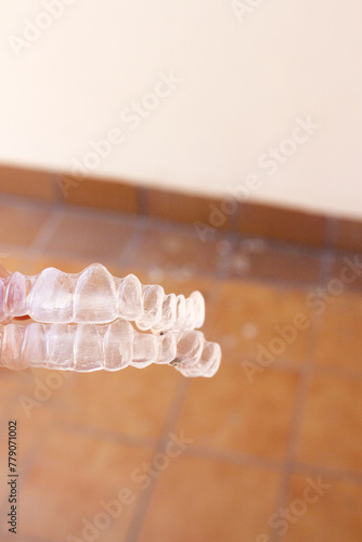 Invisible teeth aligner on light background